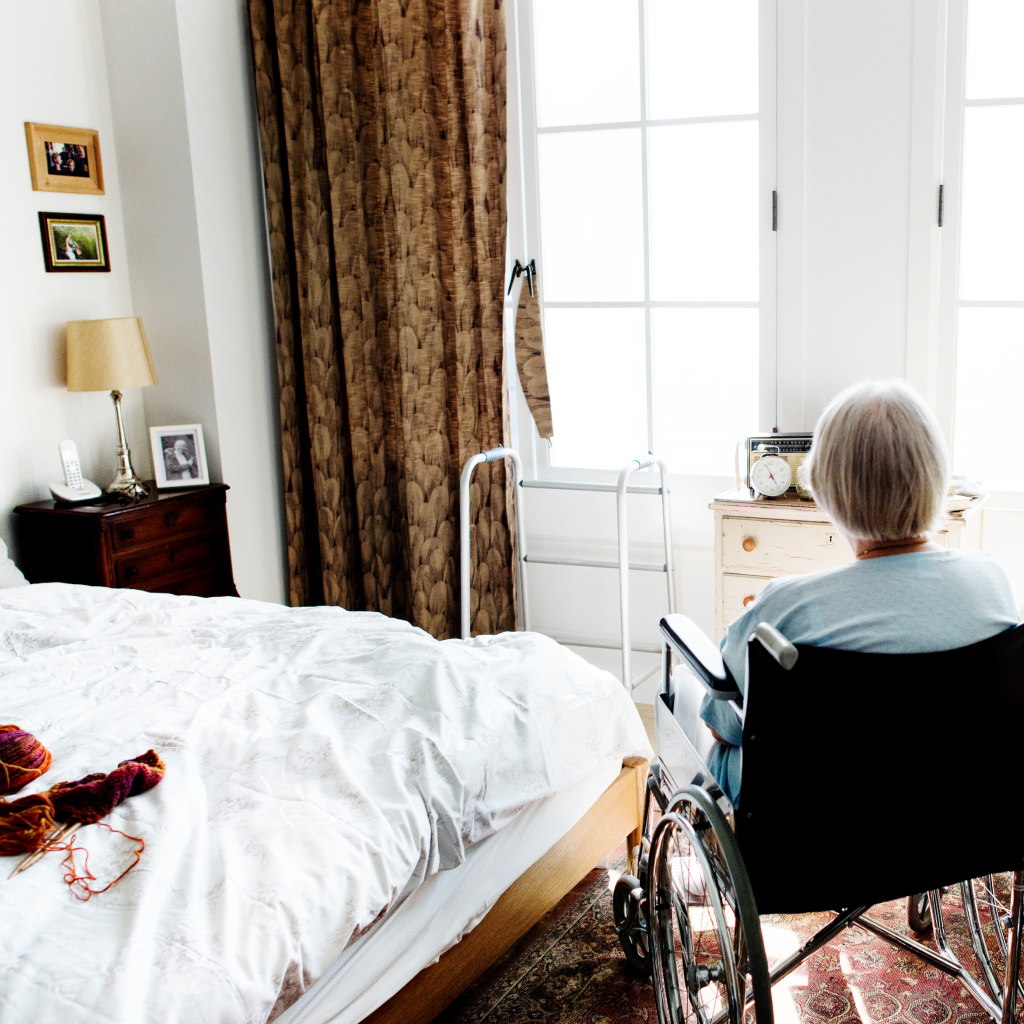 Senior Lady in Wheelchair on Bedroom