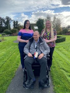 Resident Eddie with staff members outside St Doolagh's Rehabilitation Centre, North Dublin